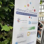 Schild mit verschiedenen Logos von Einrichtungen vom Netzwerk Oberursel
